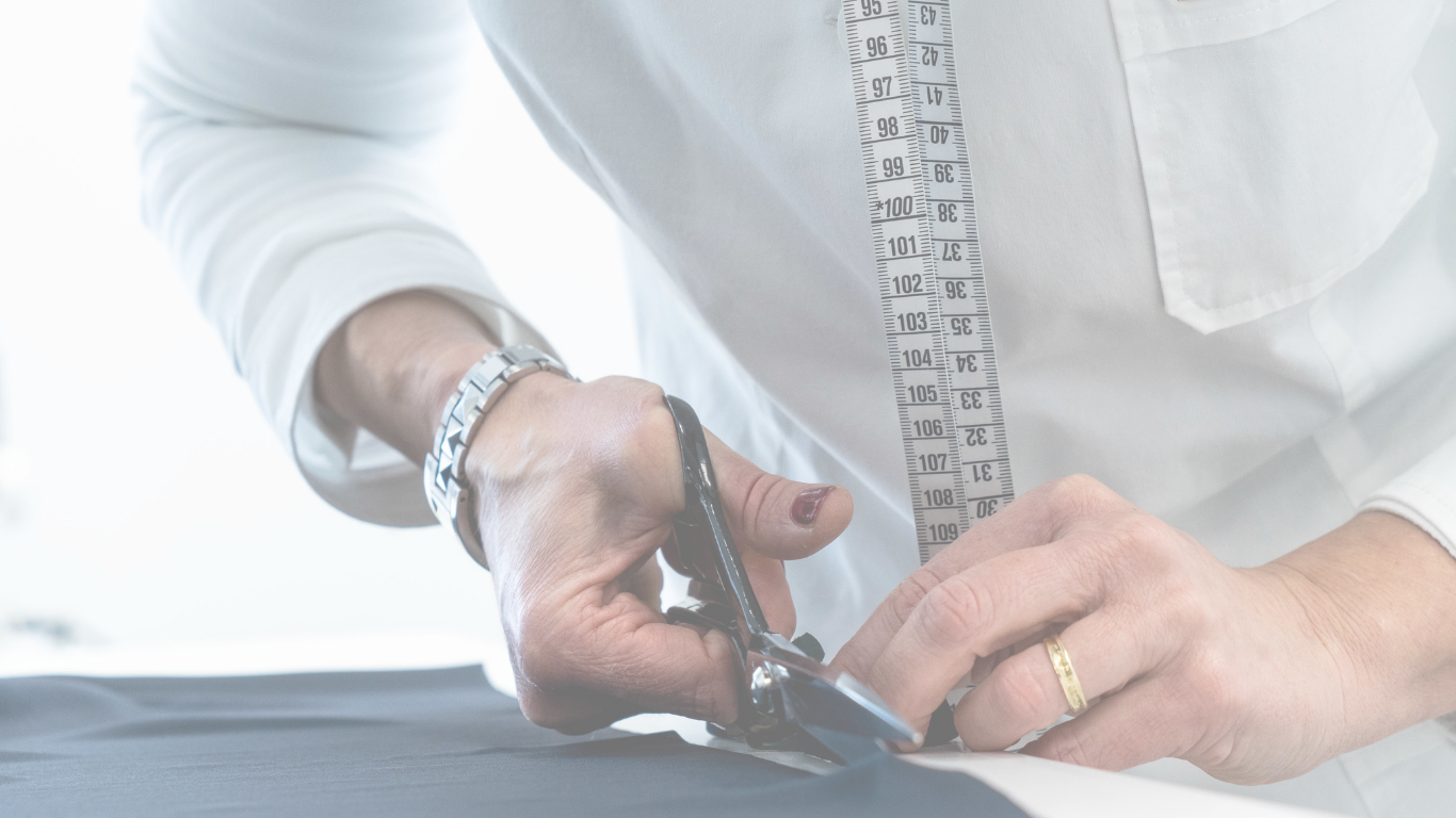 Bint Saeed—precision fabric cutting in the Abu Dhabi atelier; controlled cutting for bespoke luxury abayas produced in the UAE